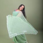 Mint Green Shimmer Organza Saree with Silver Sequin Bootis & Scallop Border