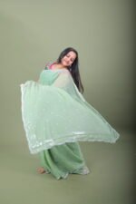Mint Green Shimmer Organza Saree with Silver Sequin Bootis & Scallop Border